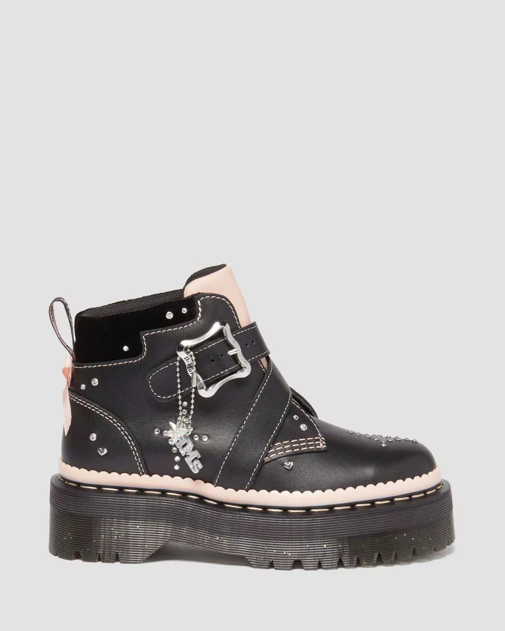 A pair of Caitie Leather Buckle Platform Boots with a black upper, a silver buckle, and a chunky sole.