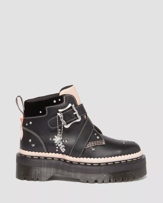 A pair of Caitie Leather Buckle Platform Boots with a black upper, a silver buckle, and a chunky sole.