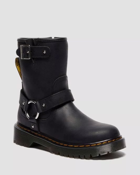 Black leather boot with buckles on a light gray background