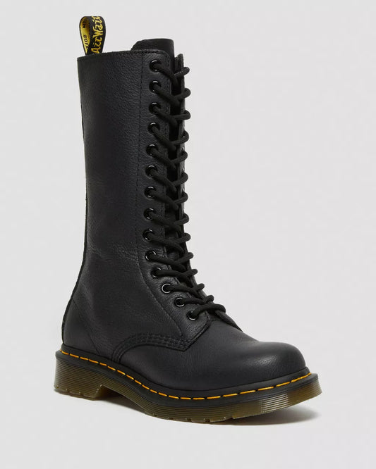 Black leather boot with yellow stitching on a light gray background