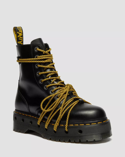Black boot with gold chains on a white background