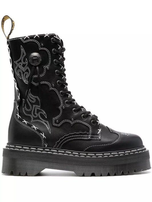 Black boot with intricate design on a white background