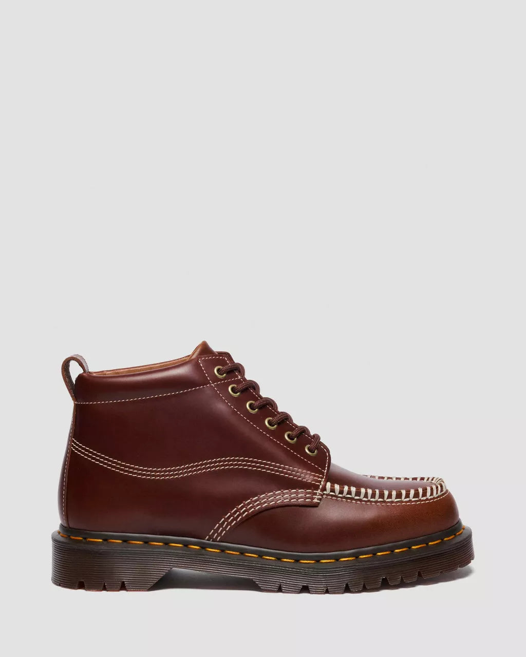 Brown leather boot with a white background