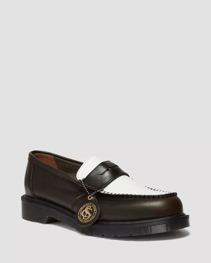 Brown leather loafer with white strap on a white background