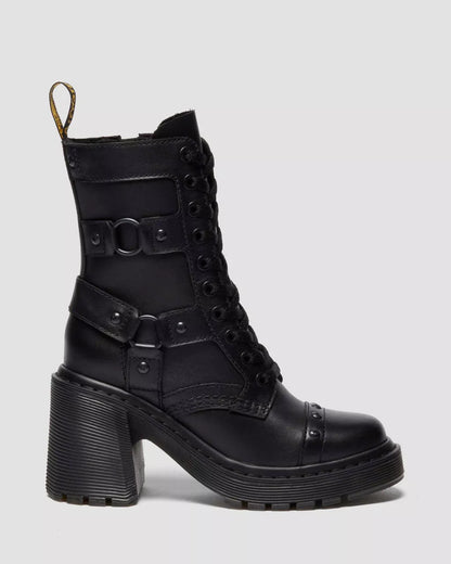 Black leather boot with buckles on a light gray background