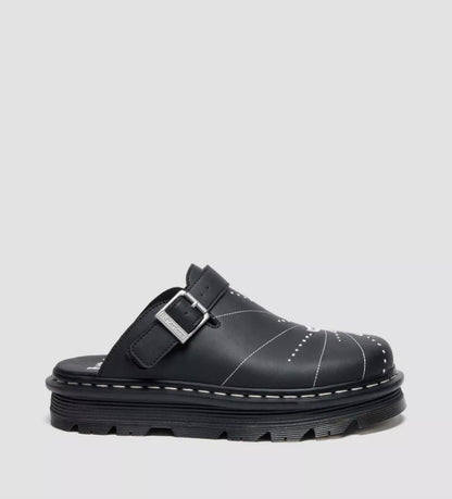 Black clog shoe with a buckle on a light gray background