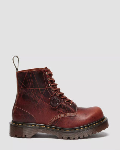 Brown leather boot with lace-up design on a light gray background