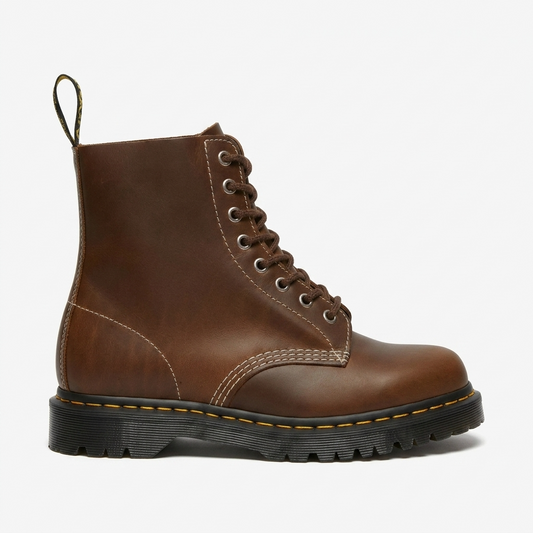 A pair of dark gray suede lace-up ankle boots with white contrast stitching and a light tan sole, shown against a plain white background.