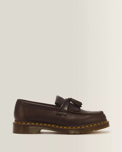 A dark brown leather tassel loafer shoe shown from a side profile view against a plain white background.