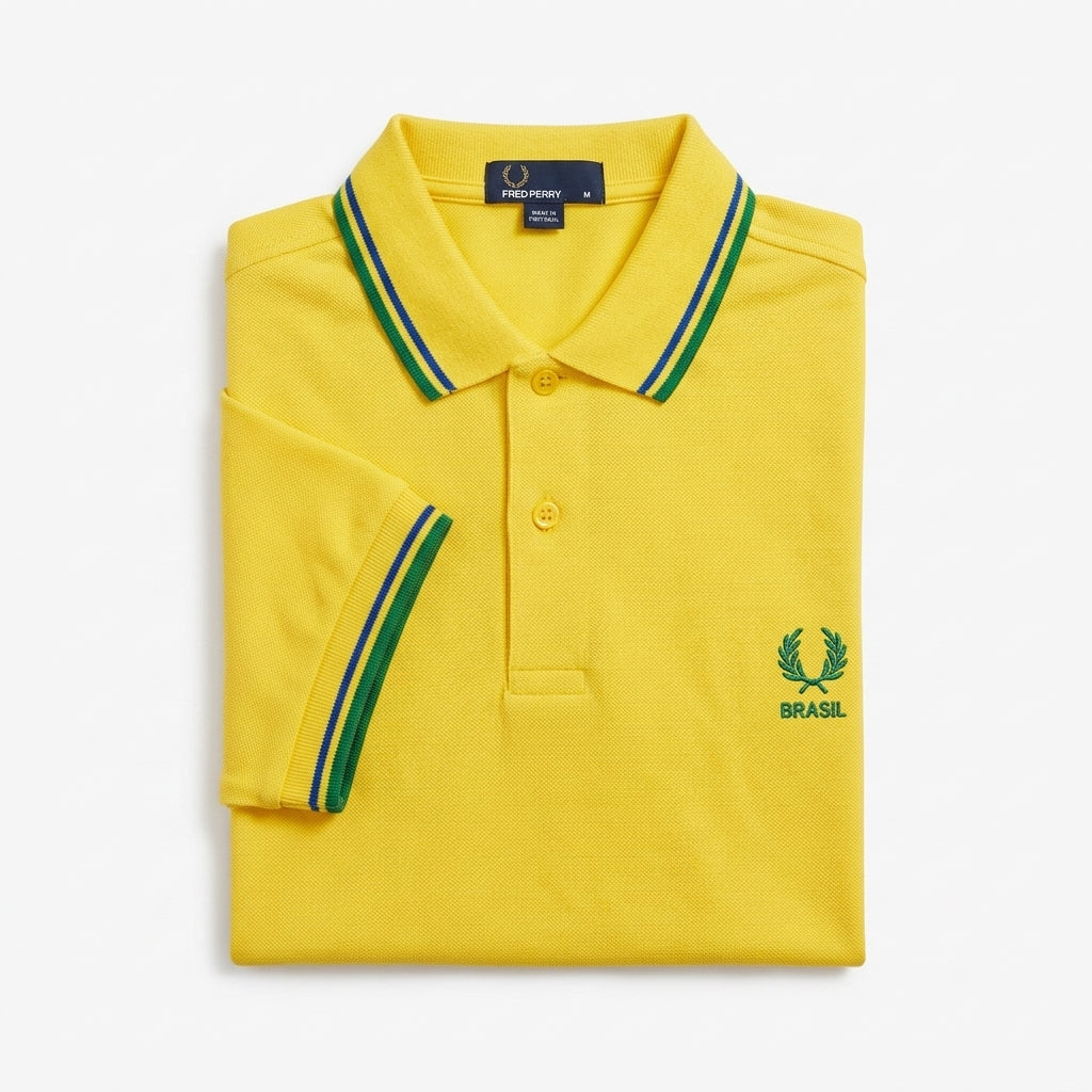 Fred Perry vintage world cup Brasil twin-tipped yellow polo shirt with green and blue accents on a white background