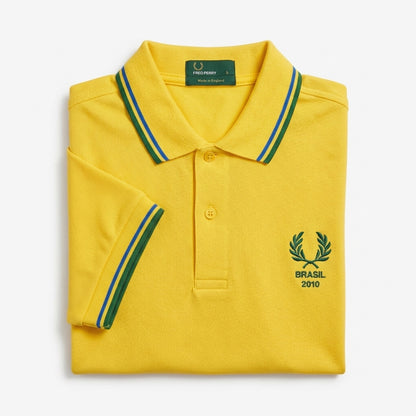 Fred Perry vintage world cup Brasil 2010 twin-tipped yellow polo shirt with green and blue accents on collar and sleeves laurel wreath logo Brasil 2010