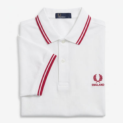 Fred Perry vintage world cup England twin-tipped white polo shirt with red accents and 'England' logo on a white background