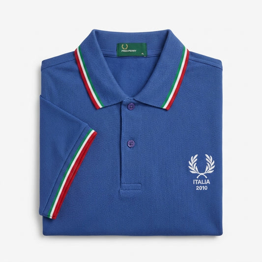 Fred Perry vintage Italia 2010 world cup twin-tipped blue polo shirt with laurel wreath logo and Italian flag colors on collar and sleeve tip on a white background