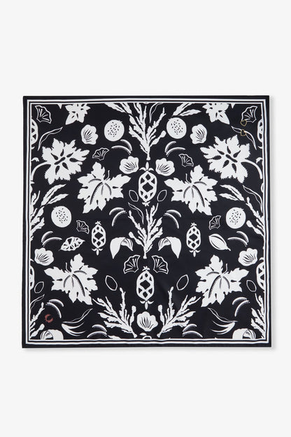 Black square with white floral pattern