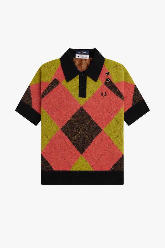 Colorful argyle patterned shirt with black collar on a white background