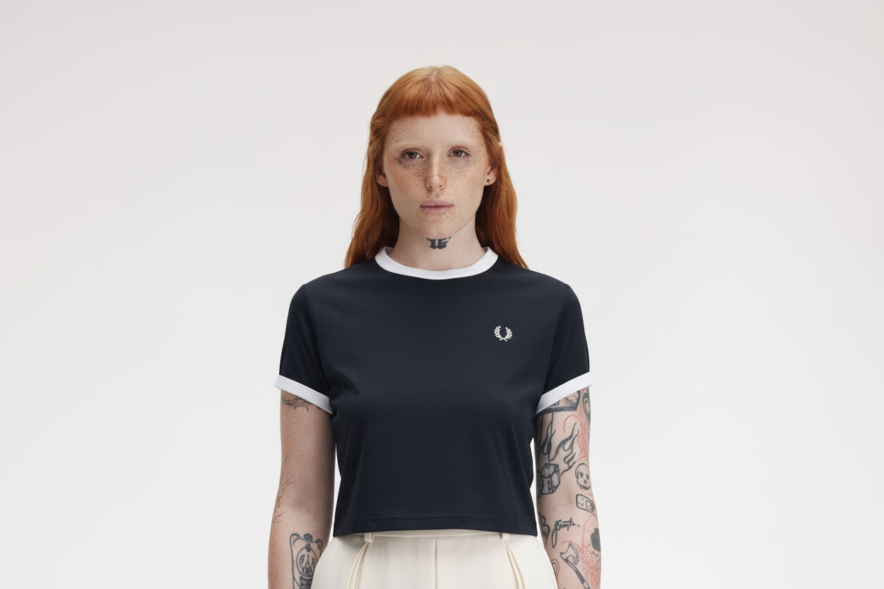Person wearing a black t-shirt with a logo on a white background