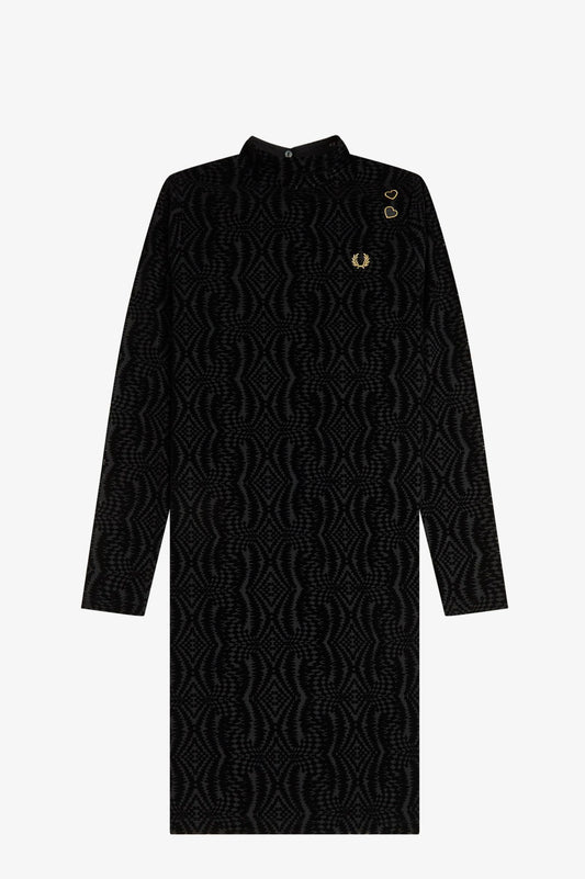Black cable knit dress with buttons on a white background