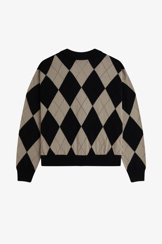 Black and beige argyle pattern sweater on a white background