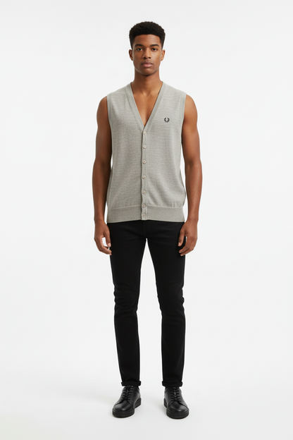 Man wearing a sleeveless gray knit cardigan with a brand logo on a white background