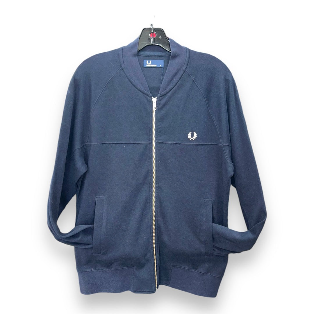 A dark blue Fred Perry zip-up jacket with a standing collar, zippered front, and a small logo on the left chest area.