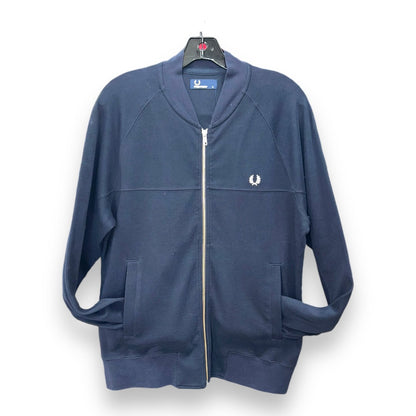 A dark blue Fred Perry zip-up jacket with a standing collar, zippered front, and a small logo on the left chest area.
