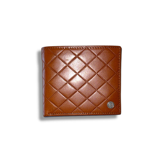 A brown Fred Perry embossed quilt billfold wallet with a geometric pattern.