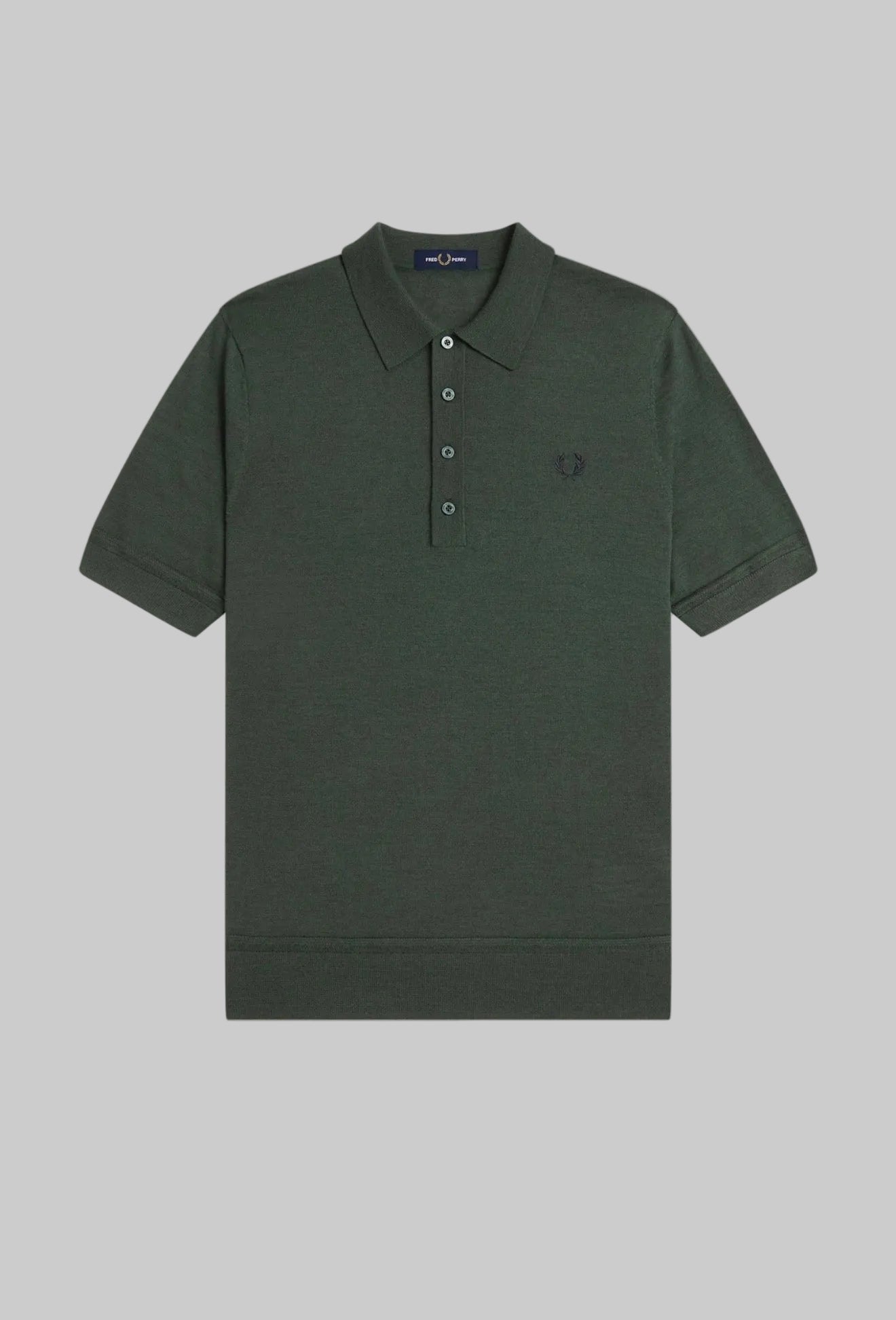 Dark green polo shirt with a small logo on a white background