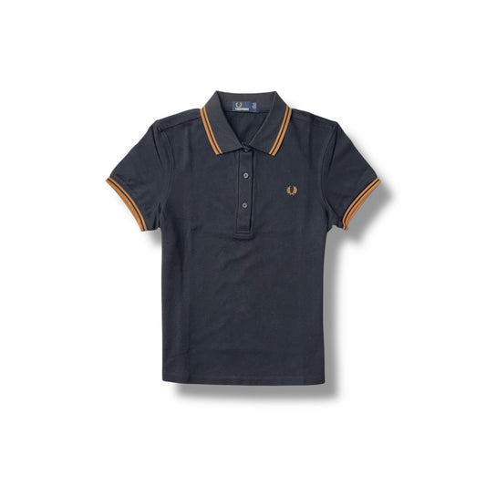 A navy blue Fred Perry ladies' polo shirt with orange twin tipping around the collar and sleeves.