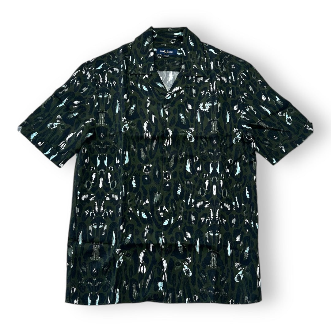 A Fred Perry leopard print Revere shirt with a classic collar, short sleeves, and a front pocket.