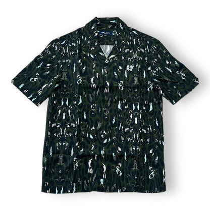 A Fred Perry leopard print Revere shirt with a classic collar, short sleeves, and a front pocket.