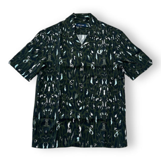 A Fred Perry leopard print Revere shirt with a classic collar, short sleeves, and a front pocket.