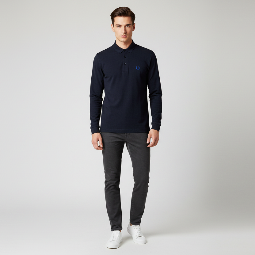 Man wearing a dark blue sweater and gray pants on a white background