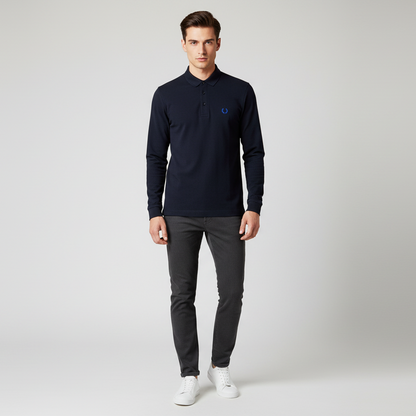 Man wearing a dark blue sweater and gray pants on a white background