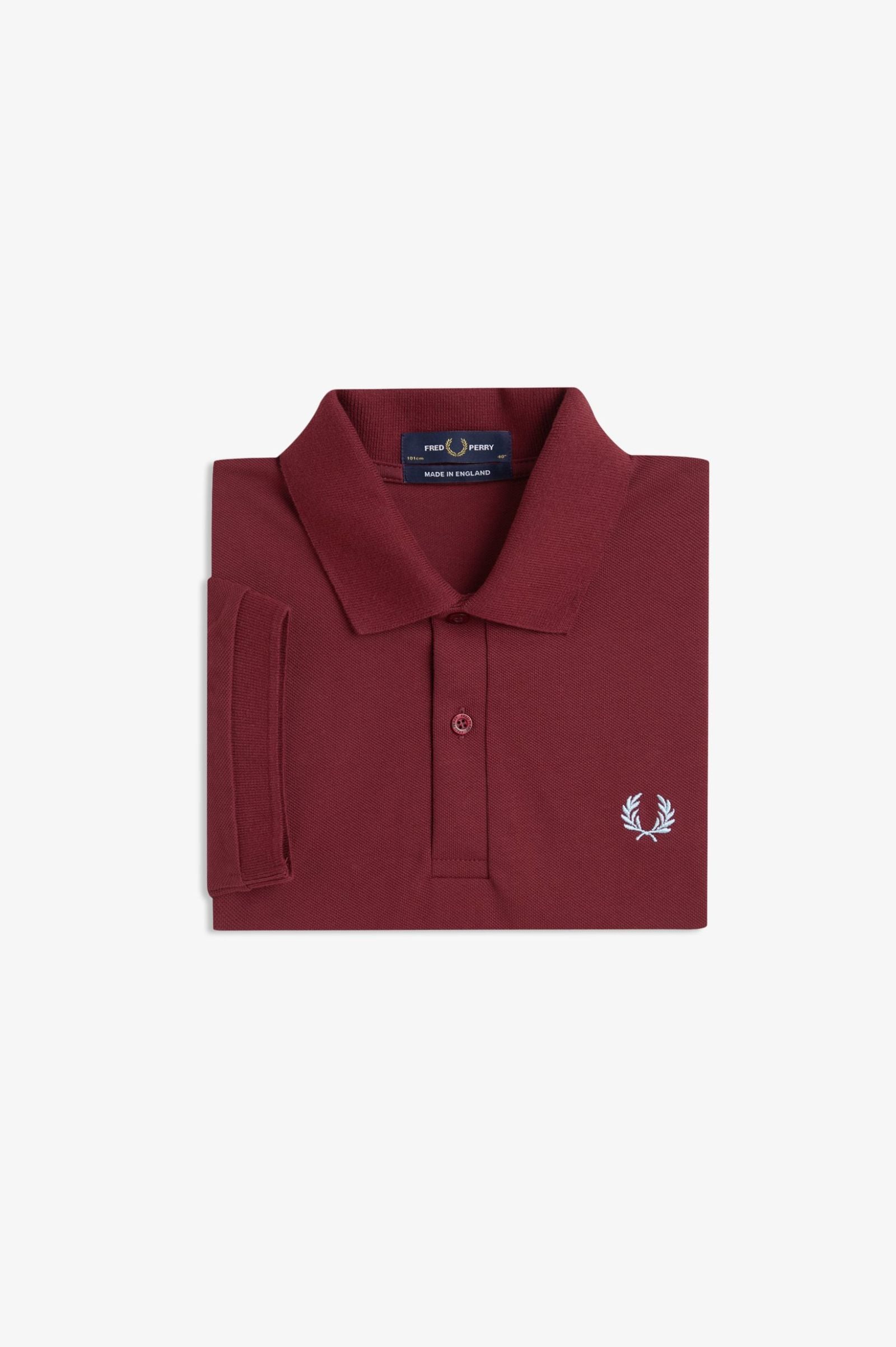Maroon polo shirt with a brand logo on a light gray background