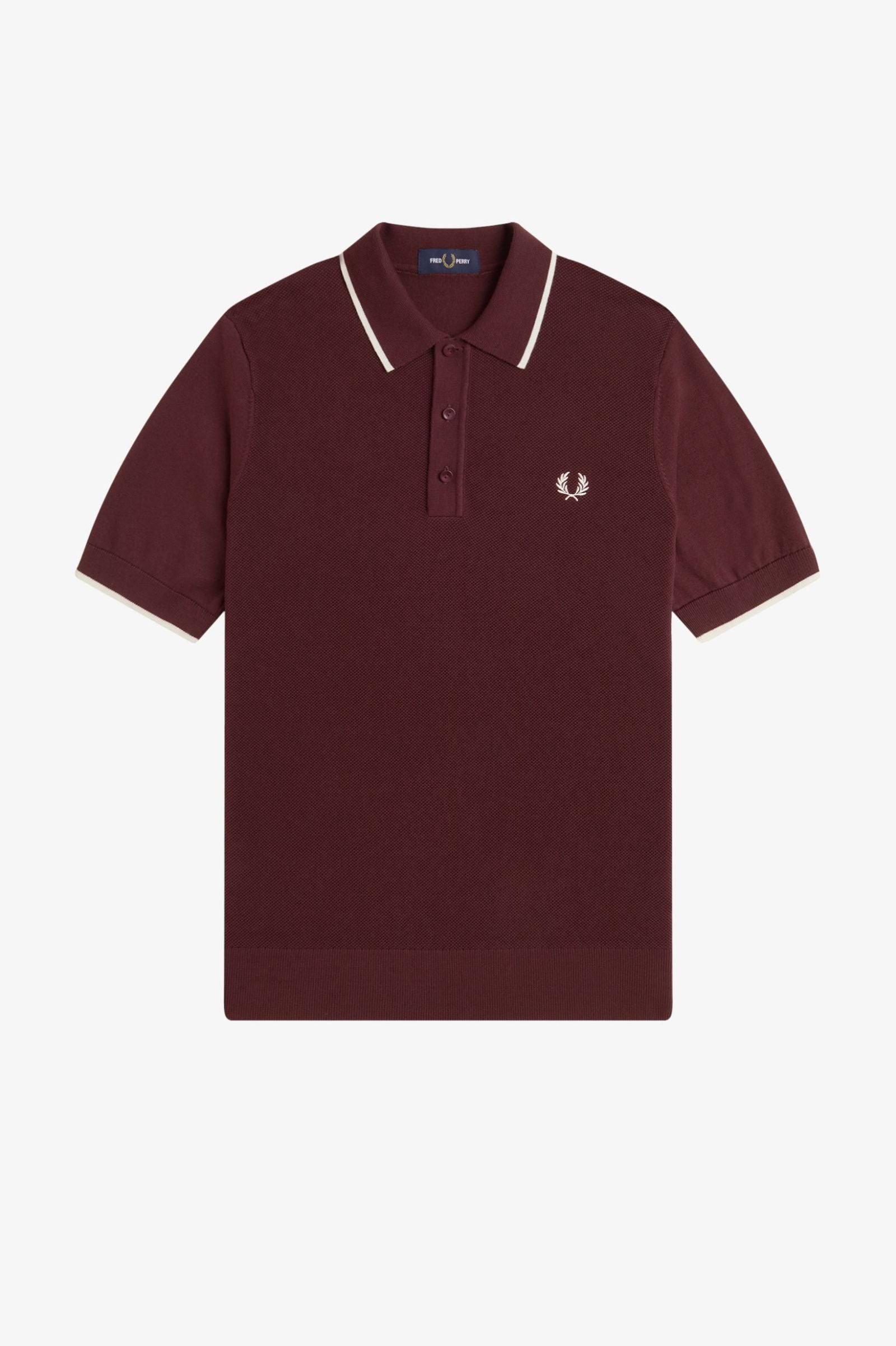 Maroon polo shirt with white trim on a light gray background