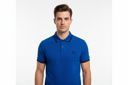 Man wearing a blue polo shirt with a brand logo on a white background