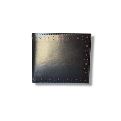 A black leather billfold wallet with brogue detailing and red accents, closed and viewed from the front.