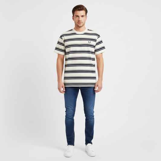 Man wearing a striped t-shirt and jeans on a white background