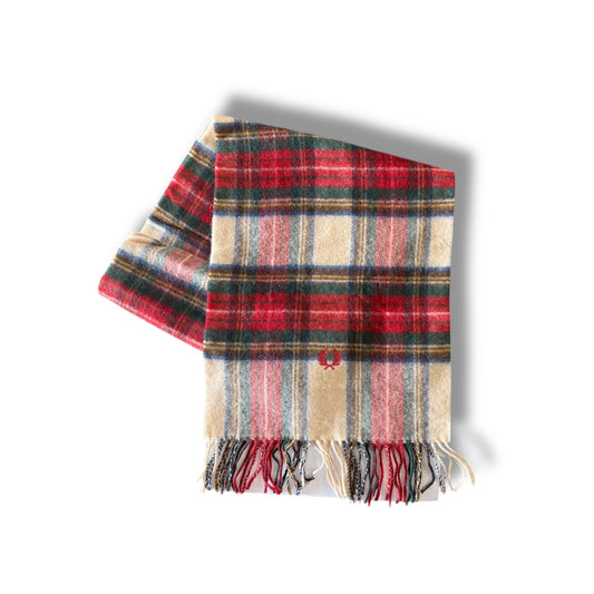 A multicolored tartan pattern scarf with fringes displayed on a white background.