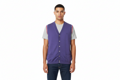 Man wearing a purple vest over a gray shirt on a white background