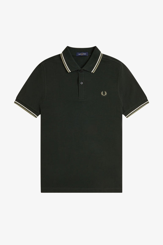 A black Fred Perry twin tipped polo shirt with white and green tipped collar and sleeve cuffs.