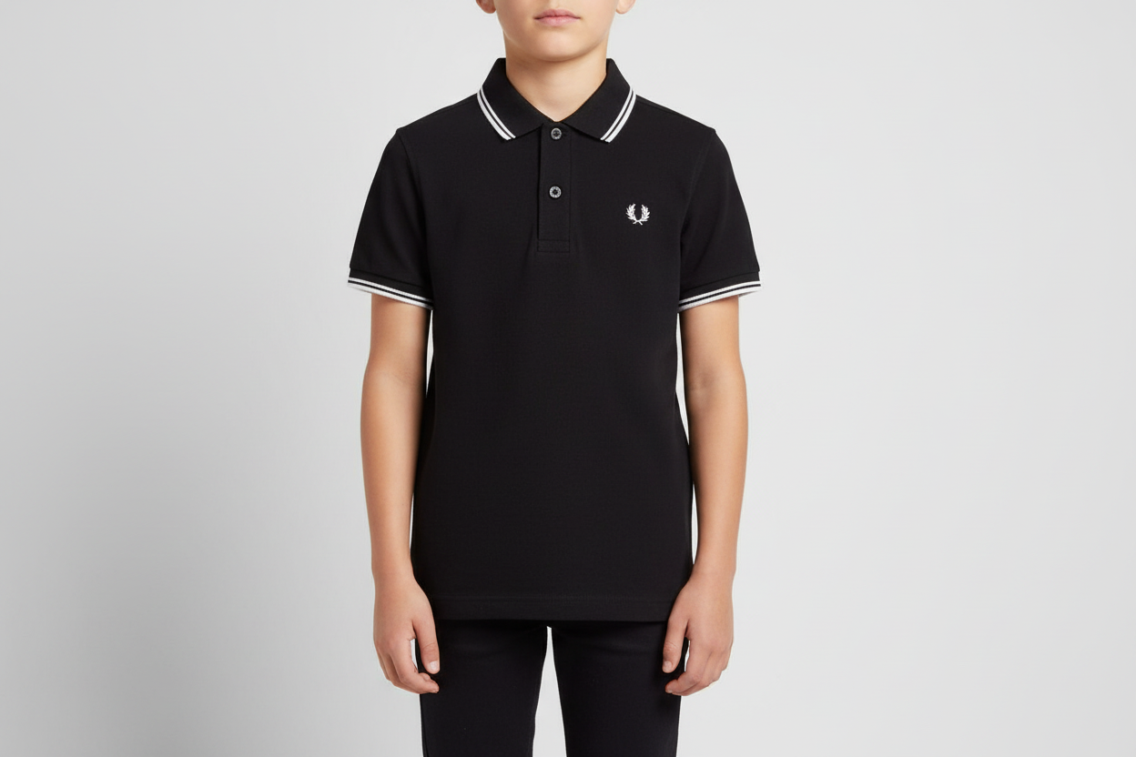 Person wearing a black polo shirt with white trim on a gray background