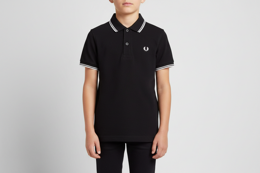 Person wearing a black polo shirt with white trim on a gray background