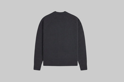 Black sweater on a light gray background