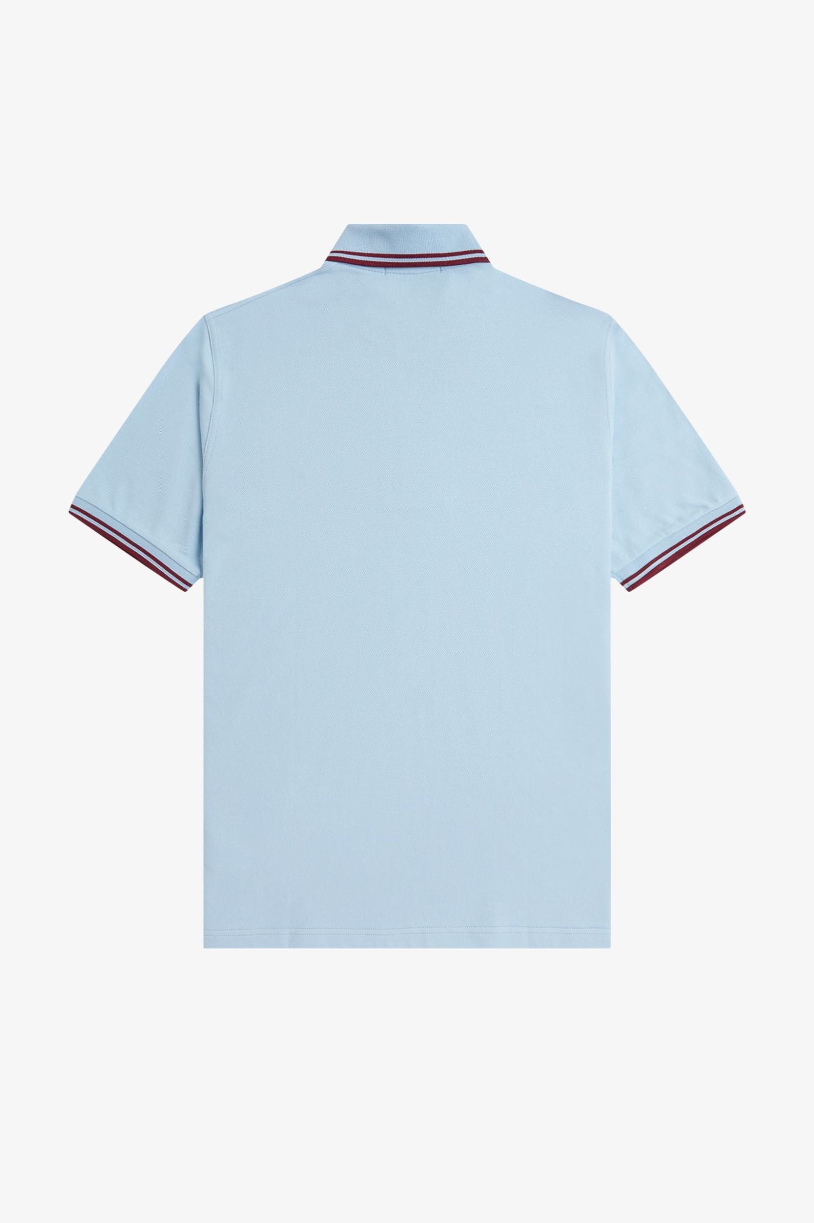 Light blue polo shirt with red and white trim on a white background