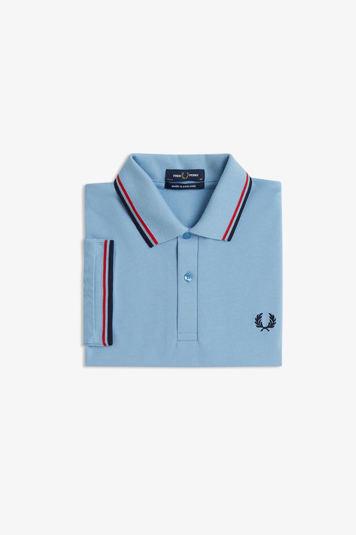 Light blue polo shirt with red and navy striped trim on a white background
