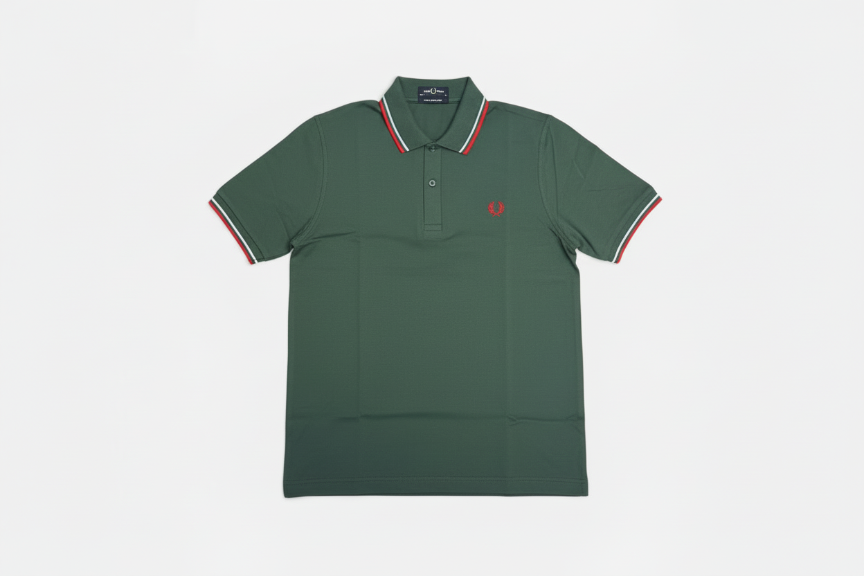 Green polo shirt with red and white trim on a light gray background