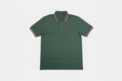Green polo shirt with red and white trim on a light gray background