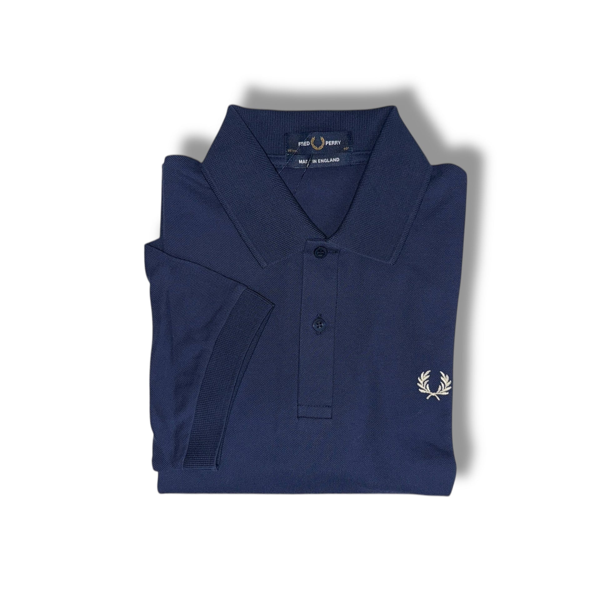 A navy blue Fred Perry polo shirt with a collar, button-up neck, and the brand's logo on the chest.