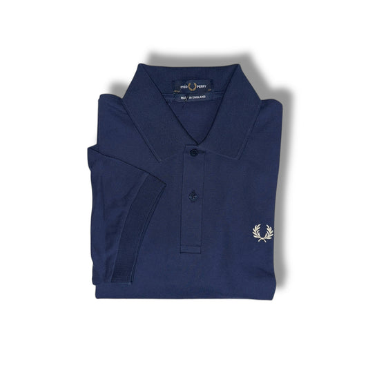 A navy blue Fred Perry polo shirt with a collar, button-up neck, and the brand's logo on the chest.